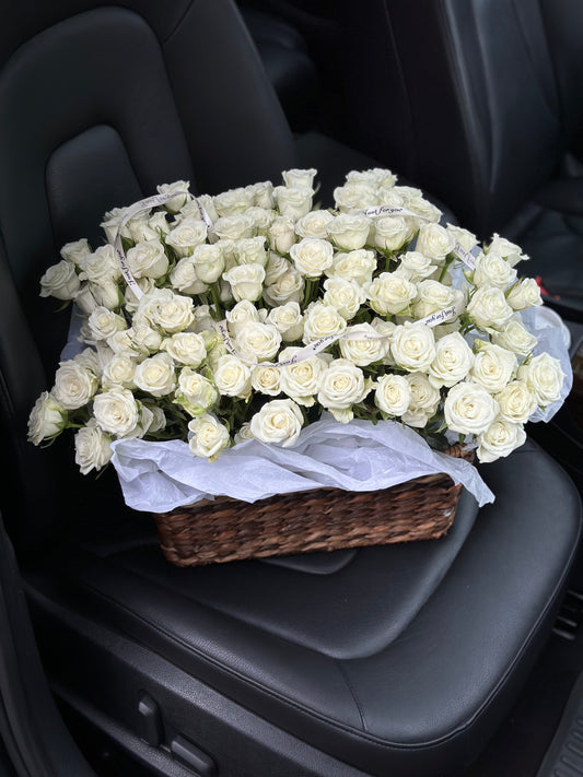 A basket of white spray roses