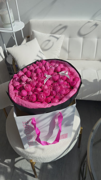 Silva pink roses in black wrapping