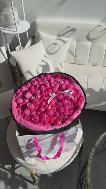 Silva pink roses in black wrapping